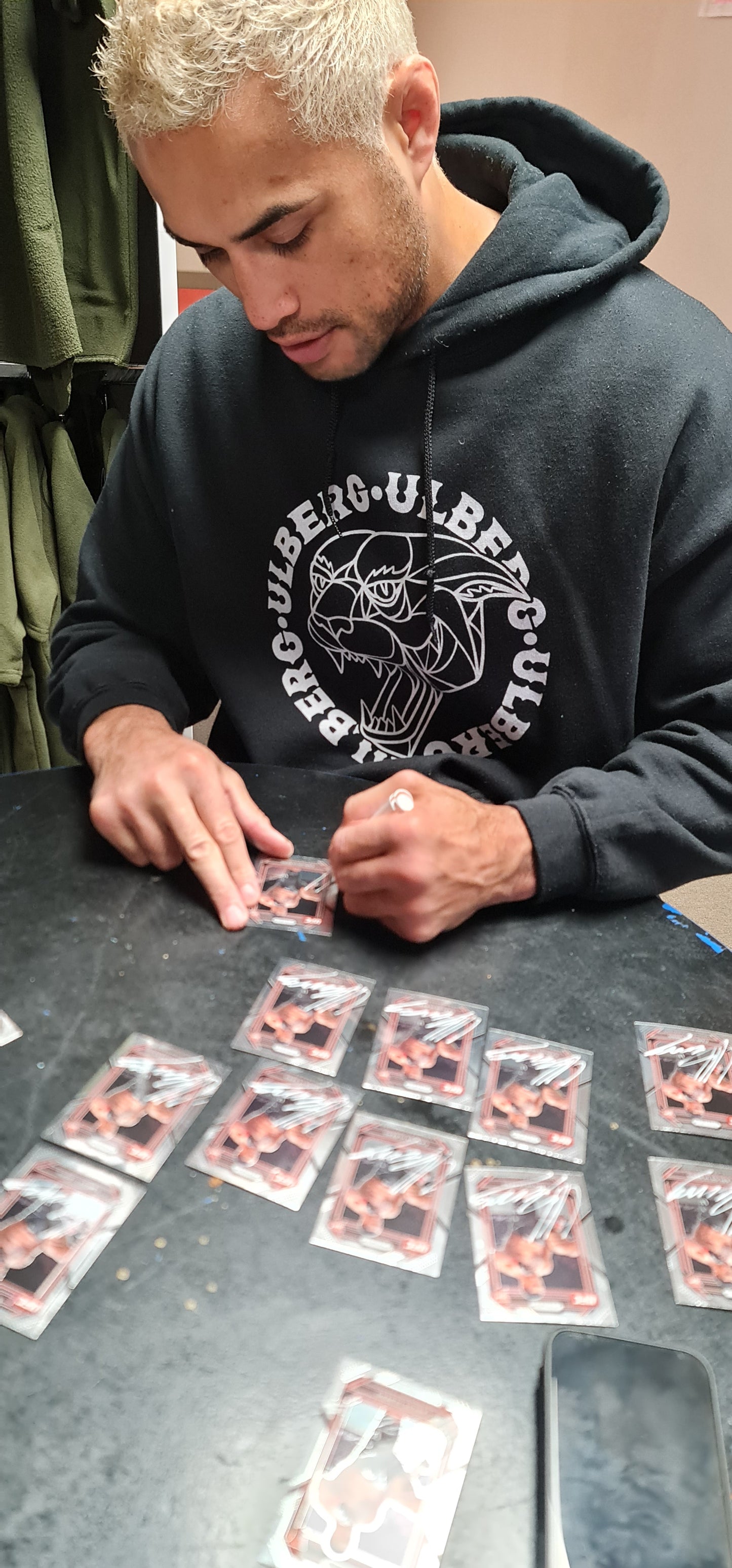 Carlos 'Black Jag' Ulberg signed glove and signed card in display case.